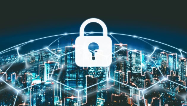 Cybersecurity concept showing a digital lock icon over a connected smart city skyline, representing secure IoT networks and data protection.